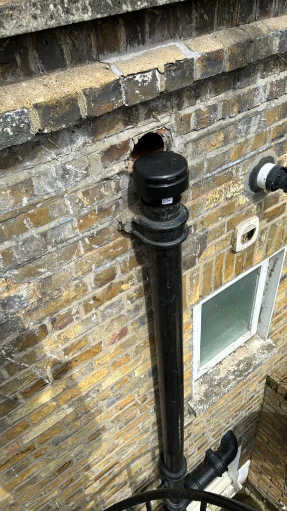 External pipework installed on a brick wall