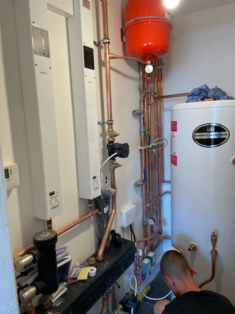 Hot water cylinder, expansion vessel and associated pipework