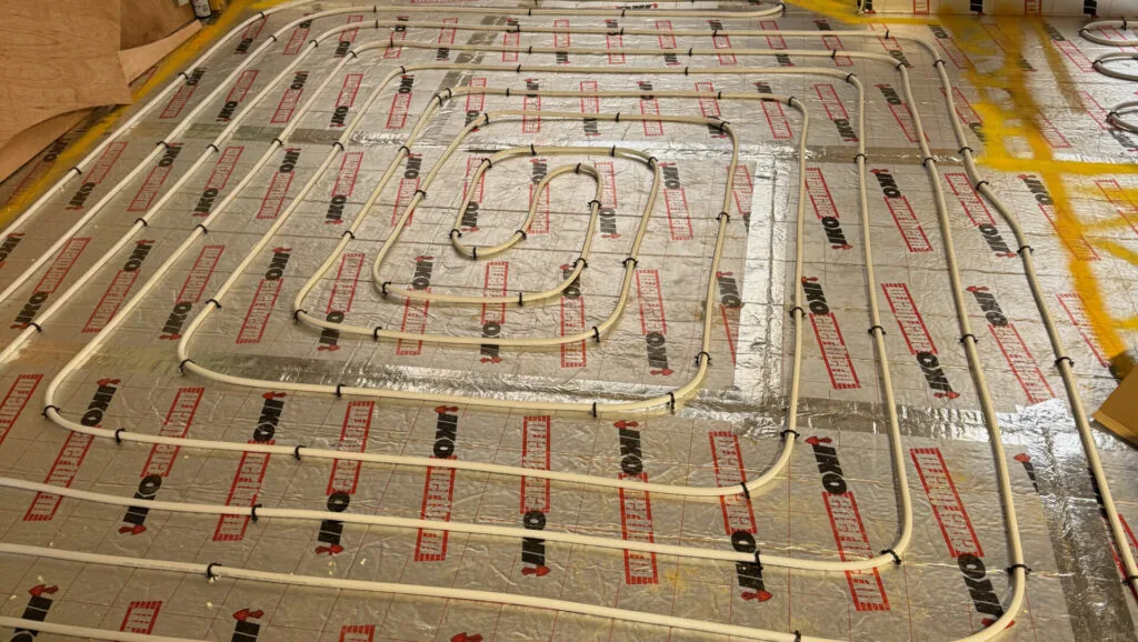 Underfloor heating pipe loops before the floor finish