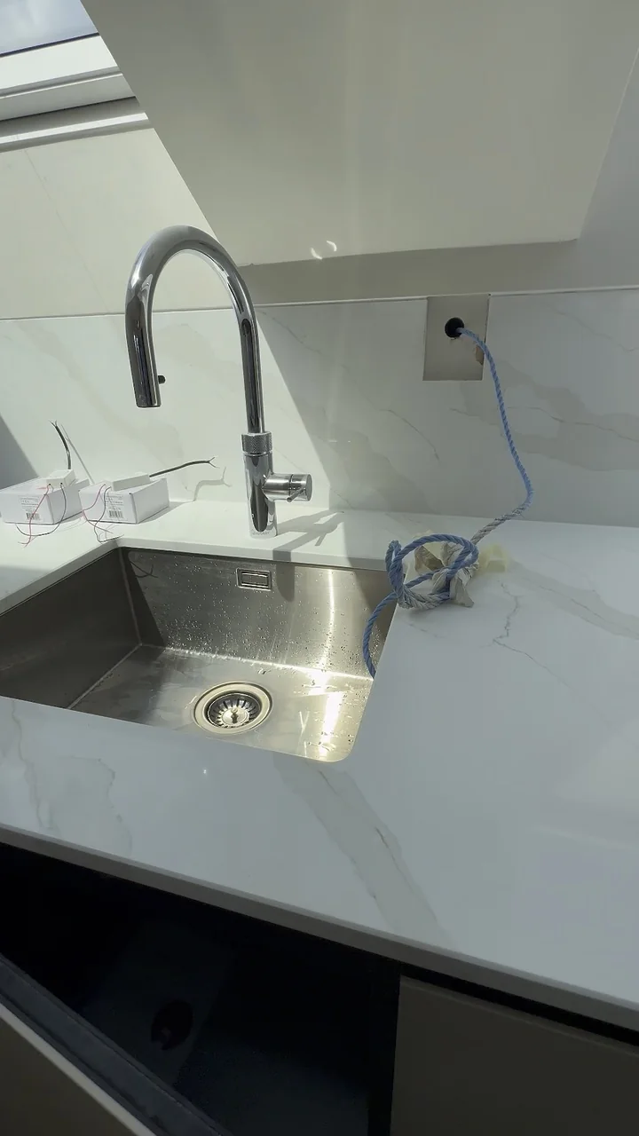 Still from Kitchen Plumbing, Behind the Finish